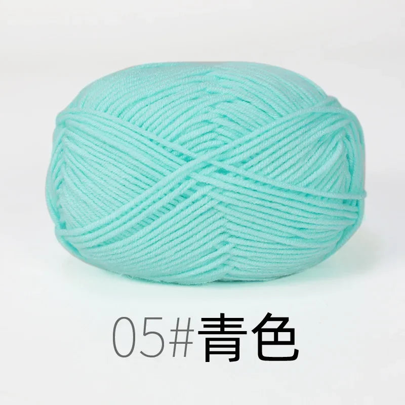 A ball of light turquoise organic cotton knitting yarn for crafts.