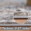 Close-up view of a gray and blue patterned floor mat showing its thickness of 0.27 inches.