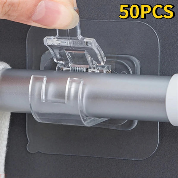 A hand is attaching a clear self-adhesive curtain rod clip to a gray window frame using a transparent adhesive pad.