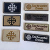 A collection of five embroidered patches featuring a cross design and the text Time for another Crusade on various colored fa