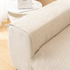 A close-up of a beige geometric chenille sofa cushion cover on a light-colored sofa.