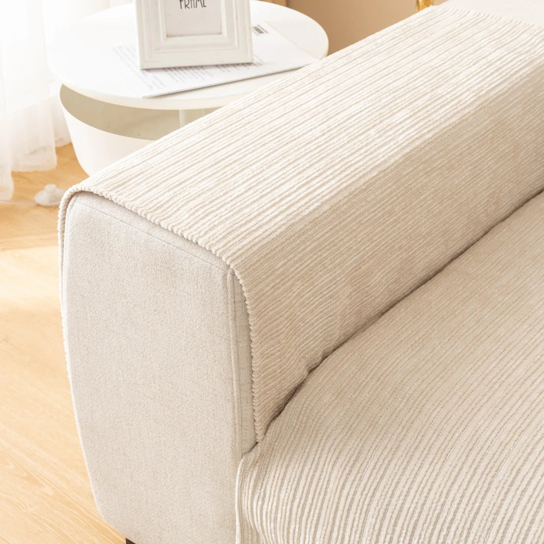 A close-up of a beige geometric chenille sofa cushion cover on a light-colored sofa.