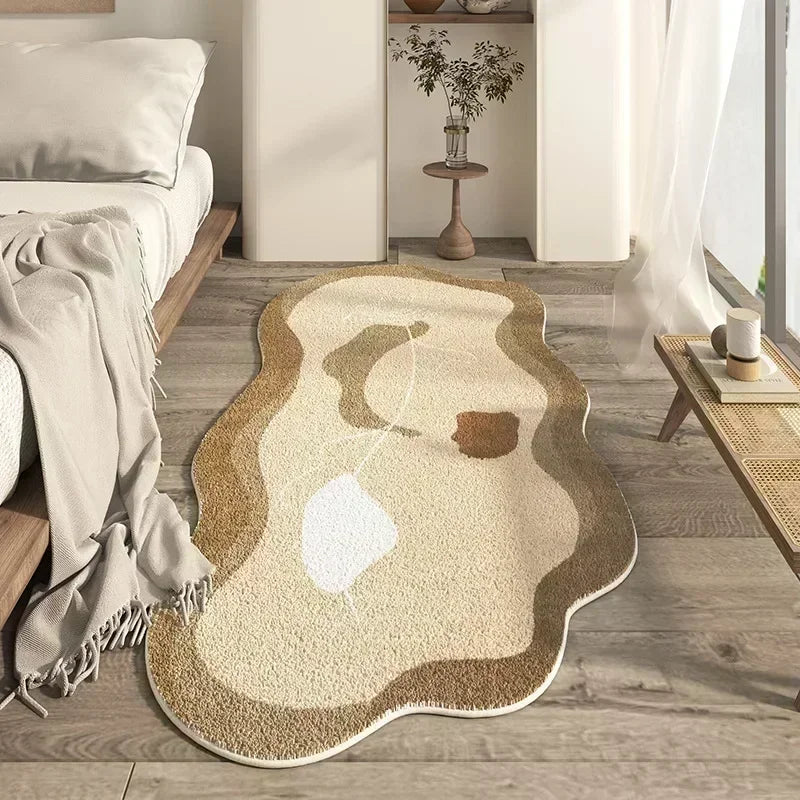 Irregular plush area rug with beige and brown abstract patterns on a wooden floor.
