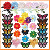 A collection of embroidered iron-on patches featuring various butterflies and roses in pink, red, yellow, purple, and blue co