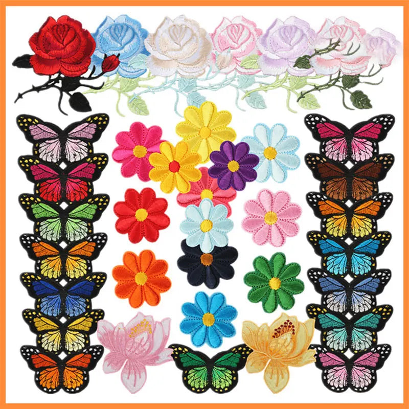 A collection of embroidered iron-on patches featuring various butterflies and roses in pink, red, yellow, purple, and blue co
