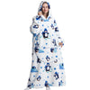 A woman wearing a white sherpa fleece oversized blanket hoodie with blue penguin embroidery.