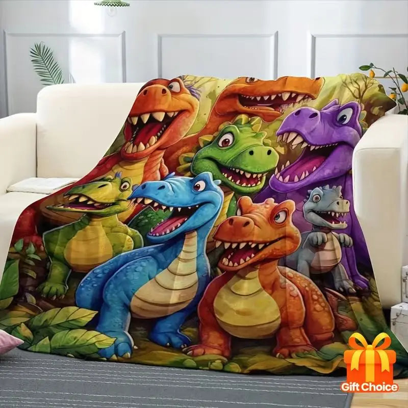 A colorful print of various dinosaurs in shades of green, orange, and purple on a flannel throw blanket.