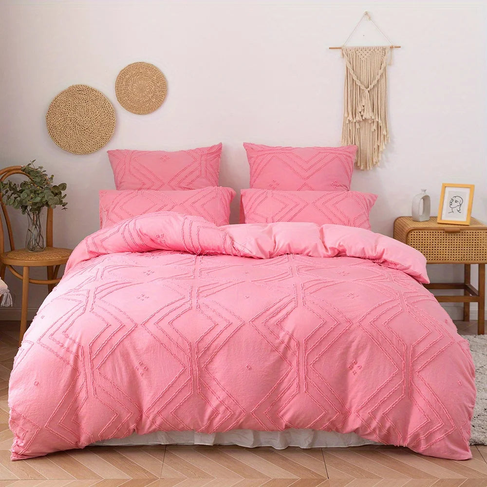 A pink bohemian grid tufted duvet cover set displayed on a bed with natural textures and light wood furniture.