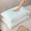 A light blue 3D cooling therapy pillow is shown stacked on a beige surface.