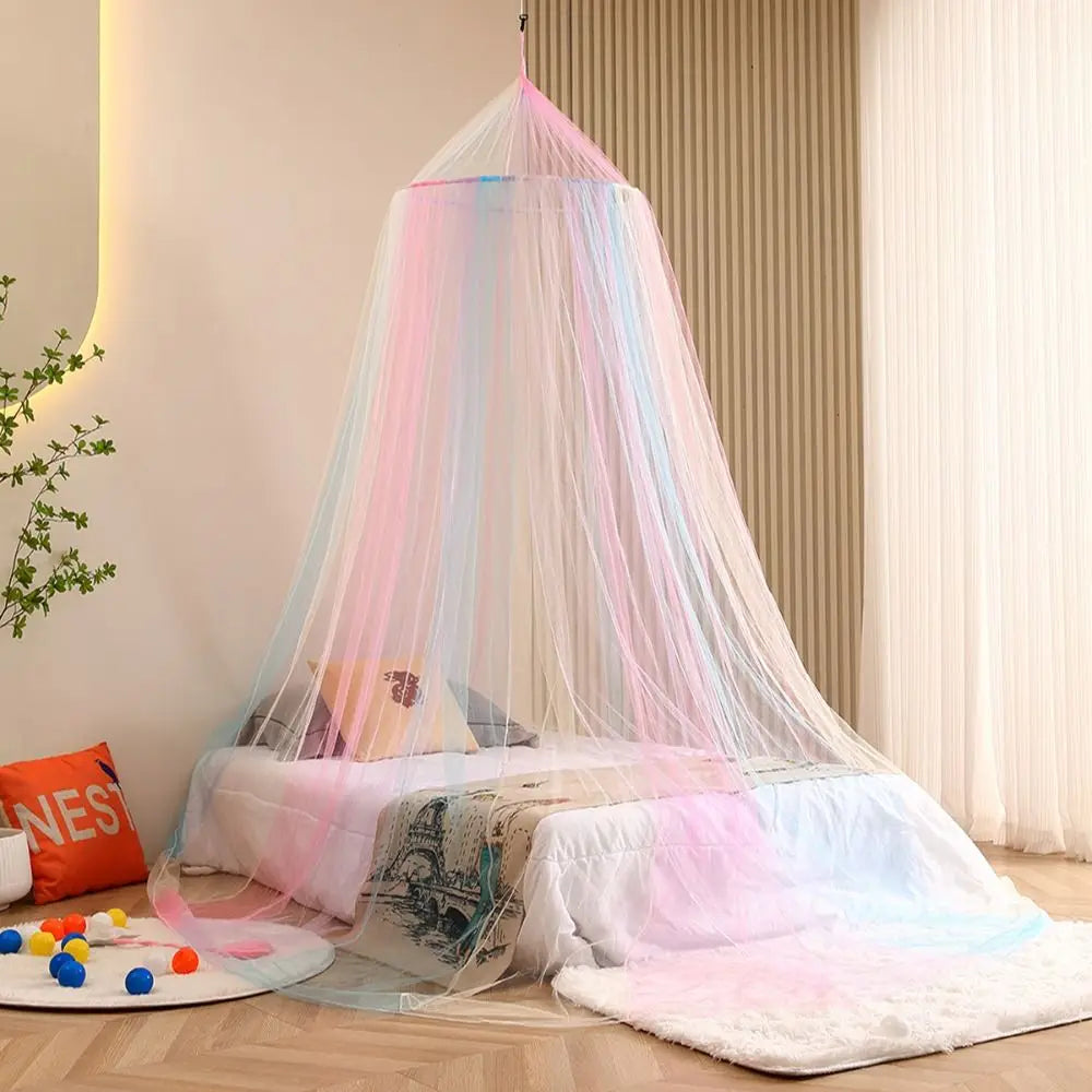 A rainbow mesh mosquito netting canopy draped over a bed, featuring pink, blue, and purple hues.