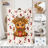 A beige flannel blanket featuring a cartoon Highland cow print with red and green accents.