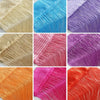 A collection of colorful threads in various shades including beige, blue, purple, pink, and orange.