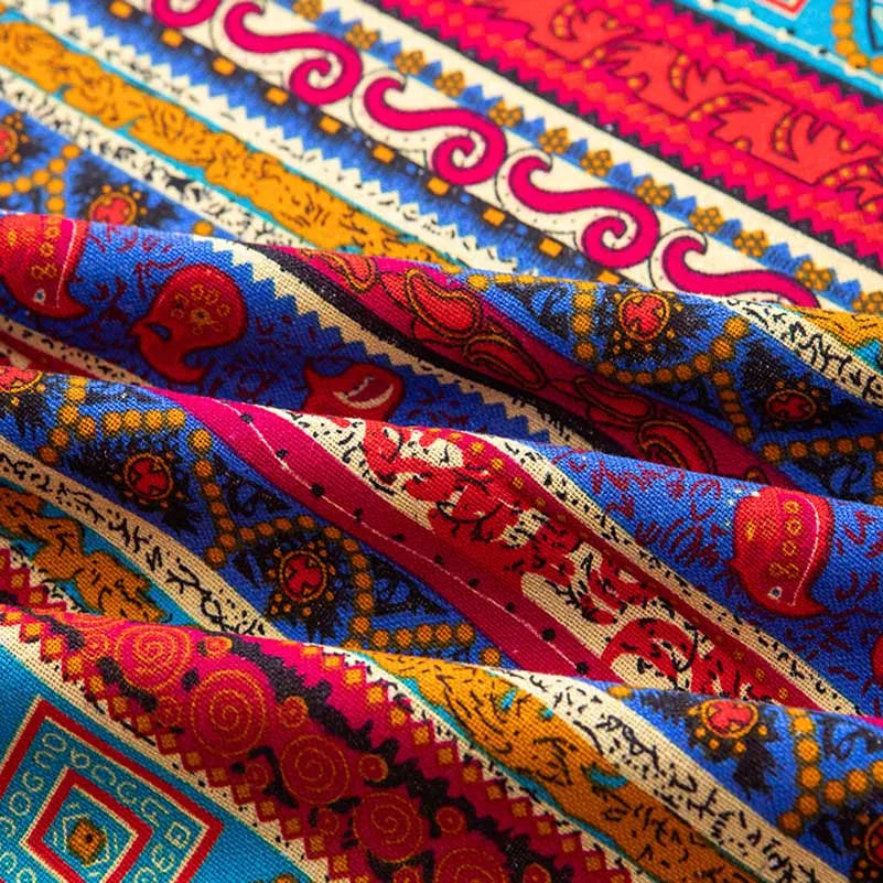 Close-up of colorful bohemian printed linen fabric displaying intricate patterns and vibrant colors.