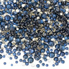 A pile of mixed blue and gold clear glass rhinestones for DIY crafts.