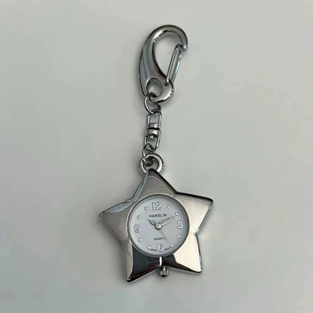 Silver star-shaped pocket watch keychain with a round clock face and adjustable chain.