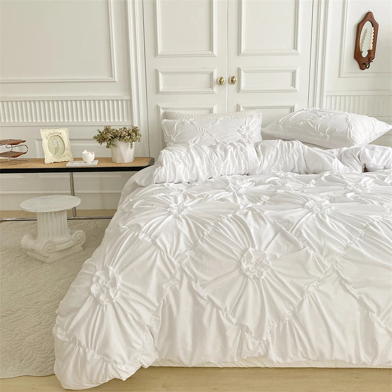 A white duvet cover set displayed on a bed with white wooden paneling and a light rug.