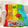 A colorful throw blanket featuring cartoon characters and the text Number Blocks.