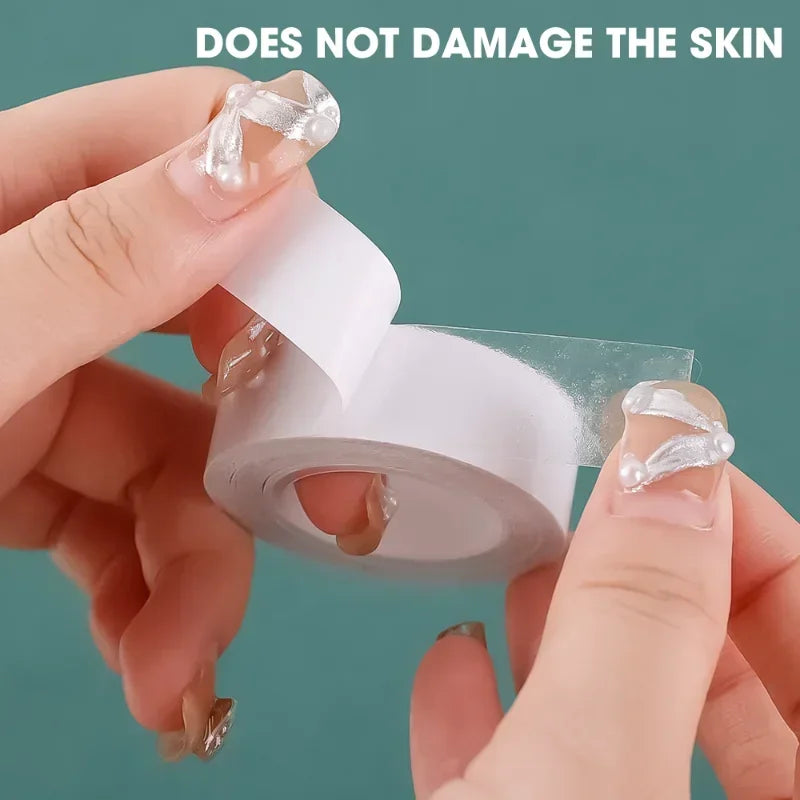A hand is applying a clear, self-adhesive tape to a finger, demonstrating that it does not damage the skin.