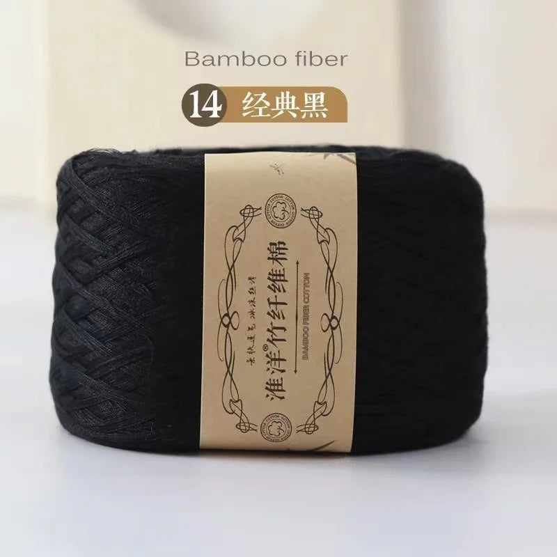 A roll of black bamboo fiber yarn labeled as 14 threads for crafting.