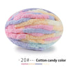 A ball of hand-knitted yarn featuring pastel colors including pink, purple, and blue.