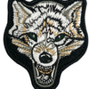Embroidered fox face patch with white, gray, and tan fur details on a black background
