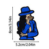 A cartoon illustration of a woman wearing a blue hat and jacket with long black hair.