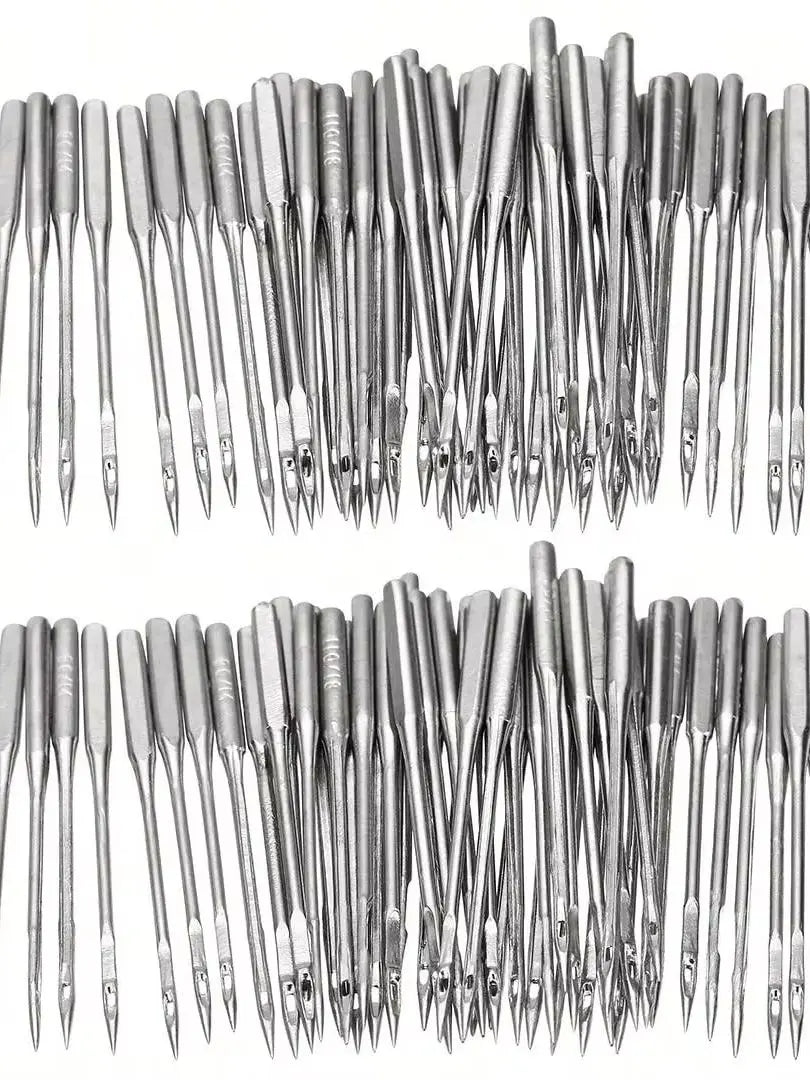 A collection of silver universal sewing machine needles arranged vertically.