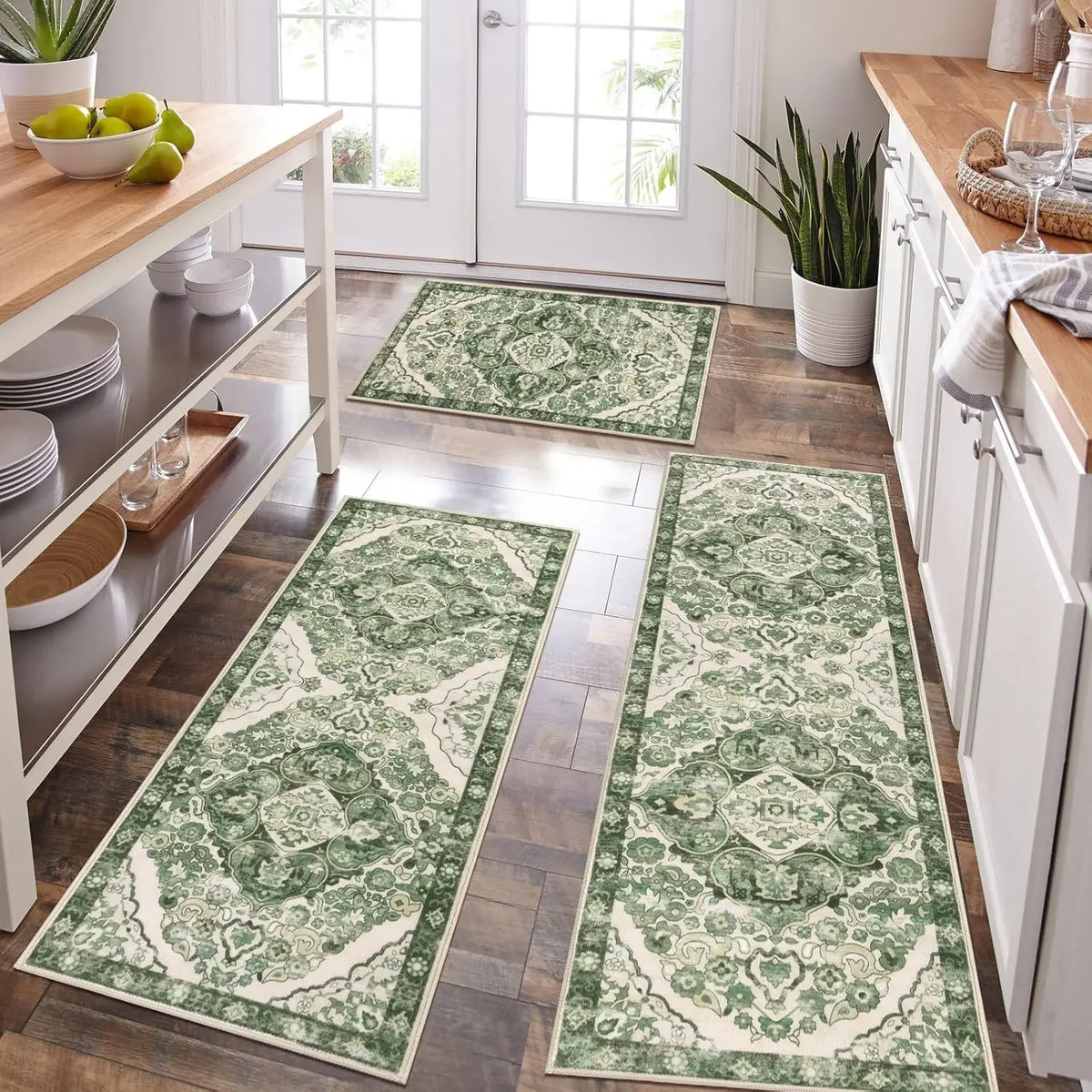 A set of green and cream patterned anti-slip floor rugs placed on a wooden floor.