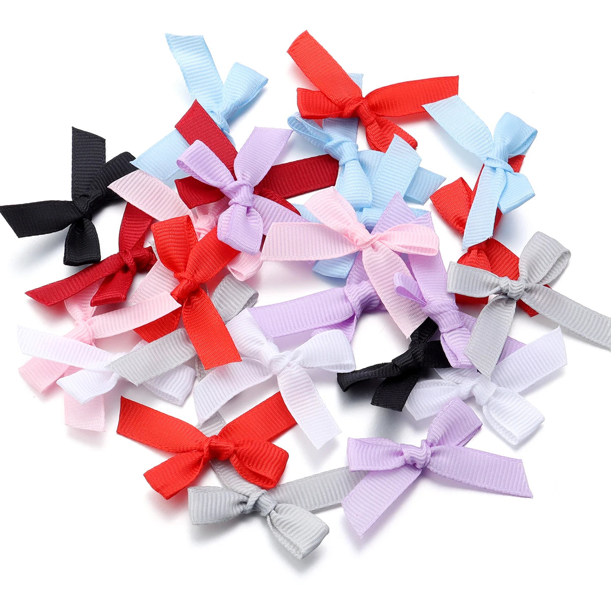 A collection of colorful satin ribbon bows in various shades including red, pink, blue, purple, and gray.