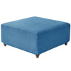A rectangular ottoman cover in a textured blue stretch jacquard fabric.