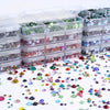 A collection of mixed size hotfix glass rhinestones in various colors and shapes displayed in clear plastic containers.