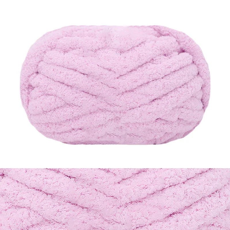 A fluffy pink hand-knitted wool finger line scarf in a ribbed texture.