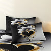 Black duvet cover set featuring a romantic floral design with gold scroll accents on a white background.