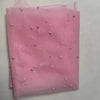 Pink pearl tulle table runner folded and displayed on a light surface.