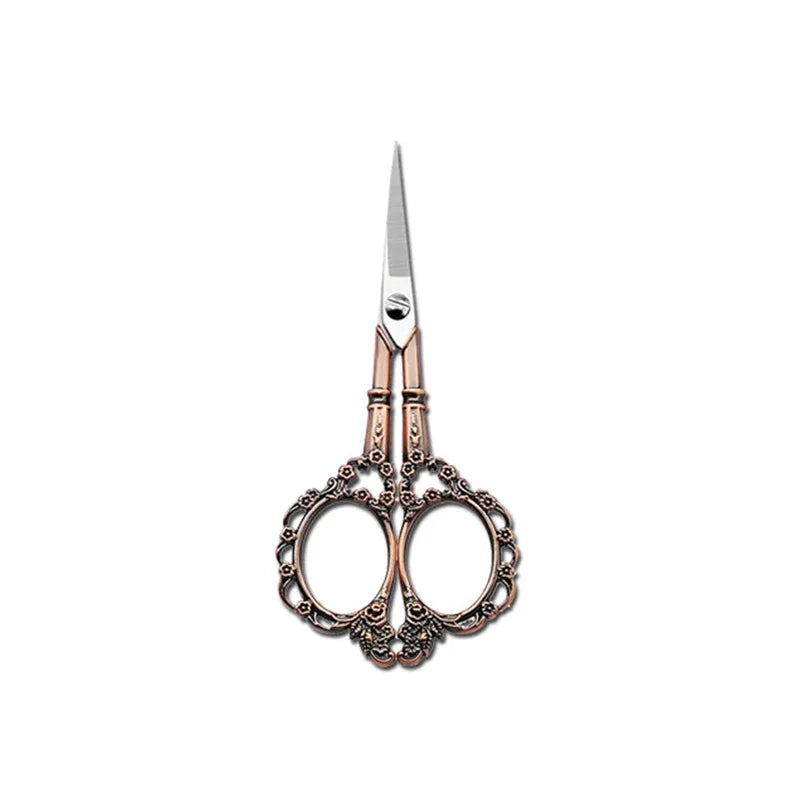 A pair of durable stainless steel crafting scissors with ornate handles and a sharp blade.