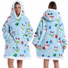 A woman models a light blue patchwork fleece hoodie with a white trim and a hood.