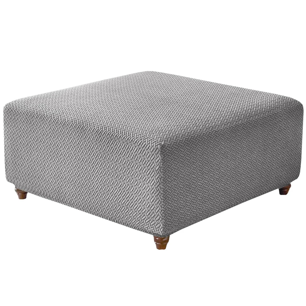 A square ottoman covered in a textured gray stretch jacquard fabric.