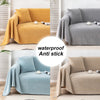 Various colors of waterproof anti-stick sofa covers draped over modern gray and yellow furniture.