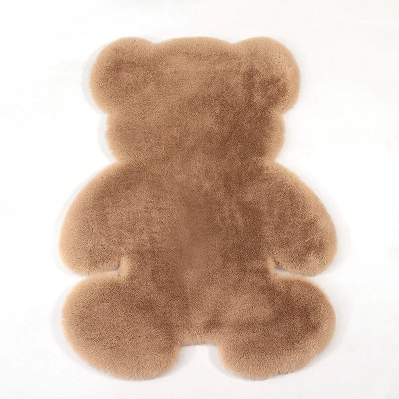 A plush bear-shaped non-slip area rug in a light brown color.