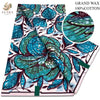 A bolt of blue and teal African wax print fabric with floral patterns.