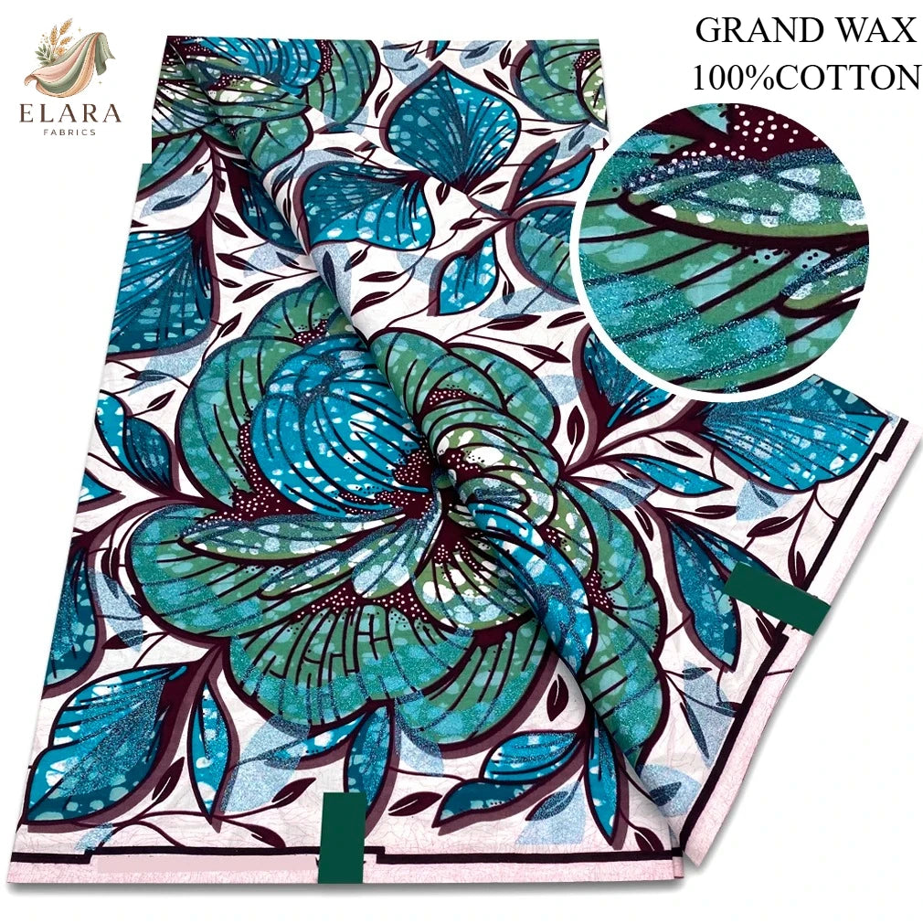 A bolt of blue and teal African wax print fabric with floral patterns.