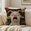 A decorative pillow featuring a realistic, screaming goat face with wide eyes and open mouth against a dark floral background