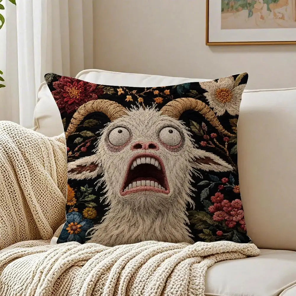 A decorative pillow featuring a realistic, screaming goat face with wide eyes and open mouth against a dark floral background