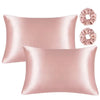 Pink satin silk pillowcases and hair rollers