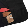 Black apron with wooden and red tools placed on the fabric for crafting or kitchen use