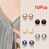 Ten pearl button pins in various shades of silver, gold, black, and blue are displayed against a light background.