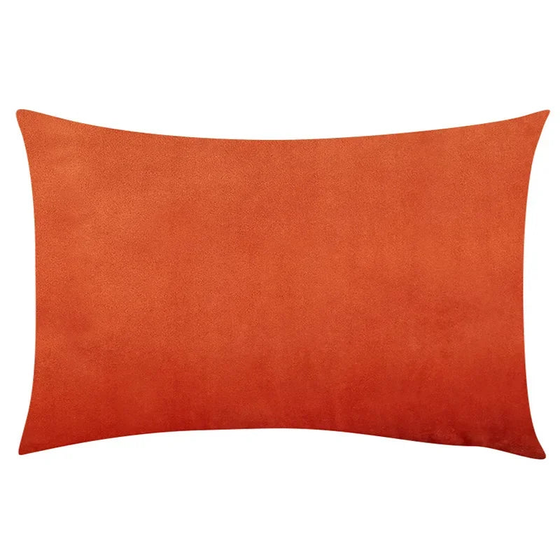 A square, burnt orange velvet throw pillow cover.