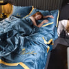 A woman is relaxing under a blue luxury ice silk blanket set on a bed.