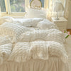 White lace seersucker duvet cover set displayed on a bed with natural light and floral decor.