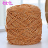 A ball of metallic copper colored silk yarn used for crocheting and knitting